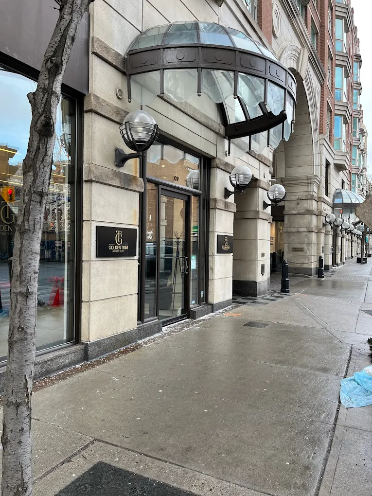 Golden Trim storefront entrance under the dome canopy